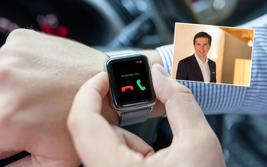 man with smart watch and incoming call in thr car
