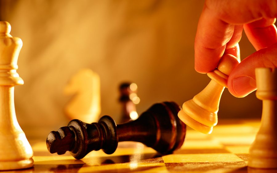 Man making a move in a game of chess